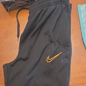Nike Kids Black Sweatpants with Gold Swoosh
